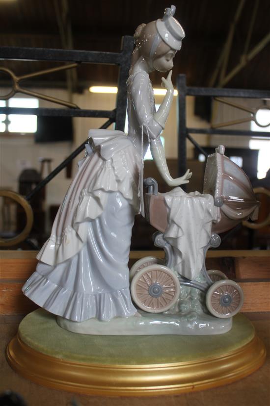 Lladro group of a mother with infant in a pram